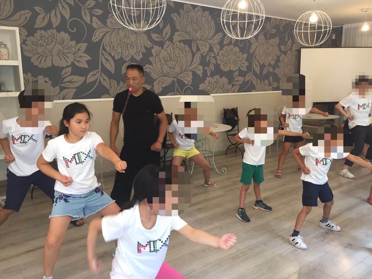 Children in MIX t-shirts practising kung fu at the MIX Summer Camp 2019