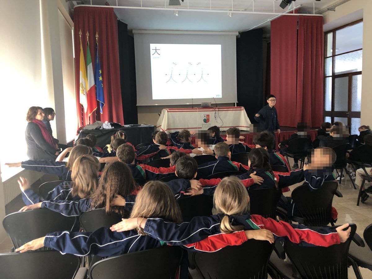 Students at Zaccaria opening their arms to form the character 大 during a MIX demo class